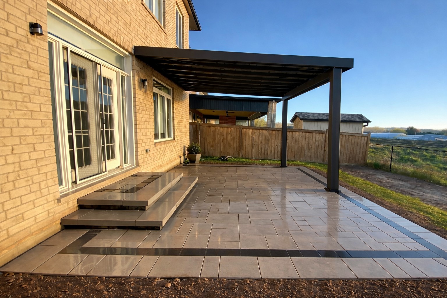 Attached pergola extending from house over patio